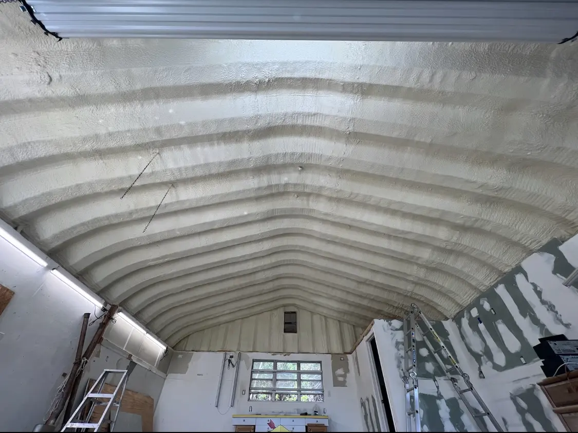 Spray polyurethane foam applied to the underside of a metal roof deck in Fort Walton Beach